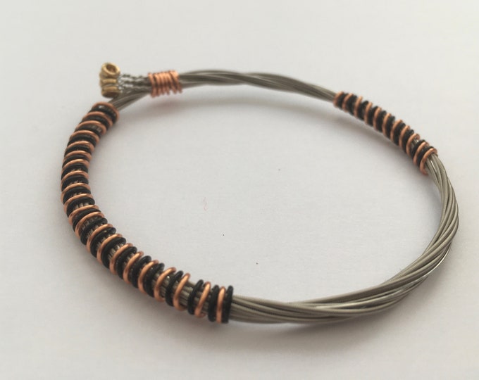 Recycled Guitar String Bracelet, styled with black and bronze copper wire. Unisex Unique Guitarist Gift
