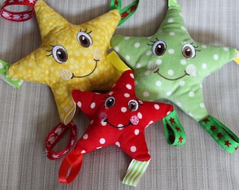 Happy Star è un giocattolo sensoriale per bambini realizzato nel cerchio della macchina da ricamo