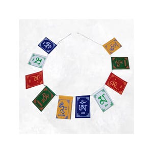 May include: A string of colorful prayer flags with various symbols and text. The flags are rectangular and feature a variety of colors including blue, green, red, and yellow. The flags are strung together with a white string.