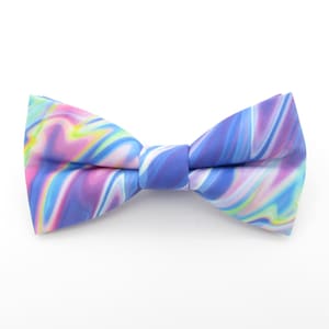May include: A blue bow tie with a swirling, abstract pattern in shades of pink, blue, and green.