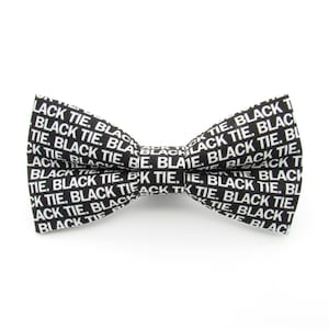 May include: Black bow tie with the words "Black Tie" repeated in white text.