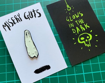 Misery Guts - Glow in the dark Pin badge