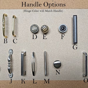 May include: A variety of door handle options are displayed on a neutral background. The handles come in various shapes, sizes, and finishes, including brass, silver, and black. The text "Handle Options" is at the top, with a note about hinge color.