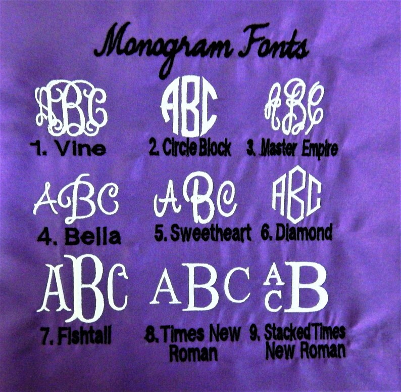 May include: A purple fabric swatch with nine different monogram font styles displayed in white. The fonts are labeled with numbers and names, including Vine, Circle Block, Master Empire, Bella, Sweetheart, Diamond, Fishtall, Times New Roman, and Stacked Times New Roman.