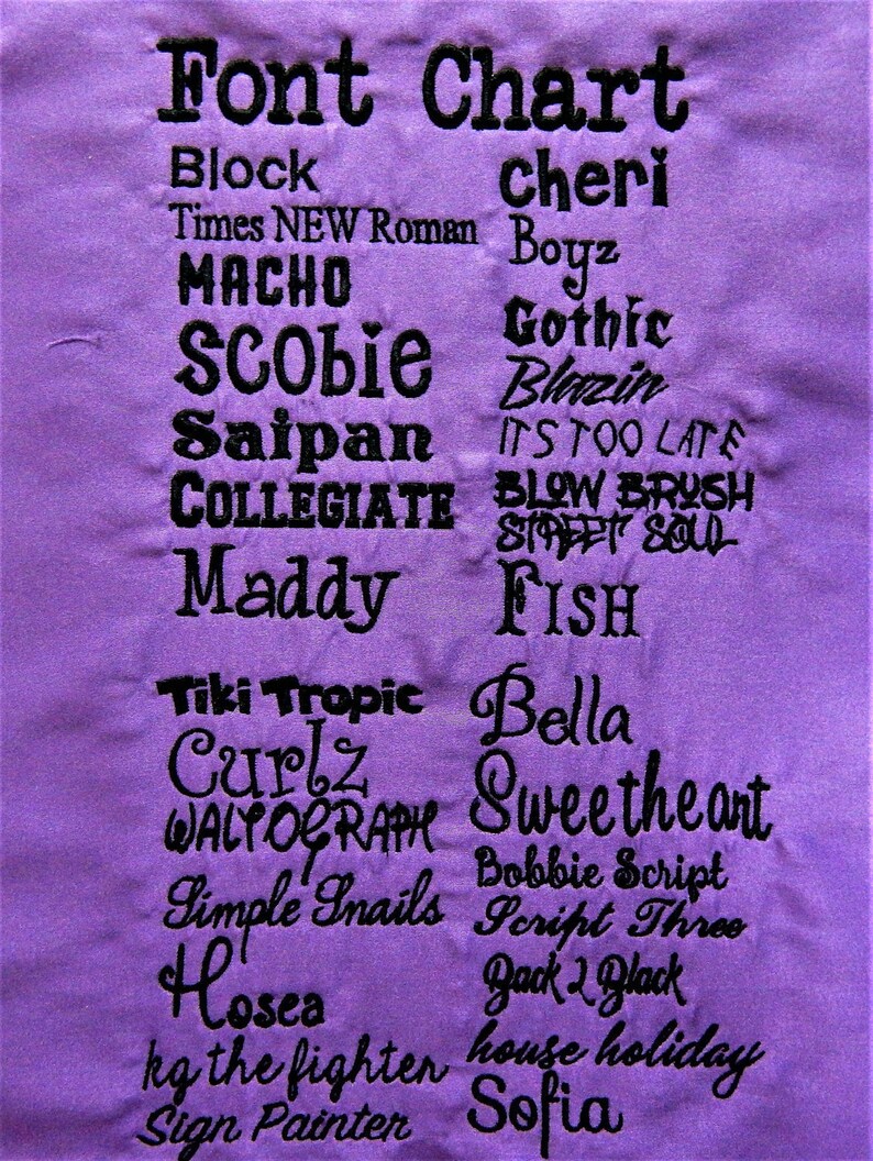 May include: A purple fabric swatch with a black font chart listing various font names and styles. The chart includes fonts such as Block, Times New Roman, Gothic, Blazin, Blow Brush, Street Soul, Fish, Bella, Sweetheart, Bobbie Script, Script Three, Back 2 Black, and more.