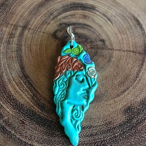 Bohemian woman pendant on a cord necklace.