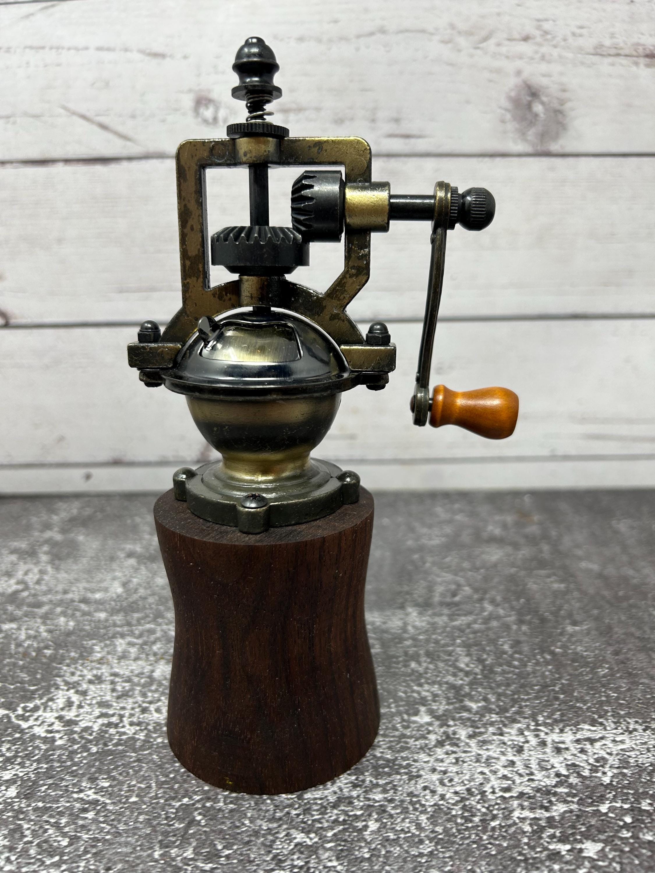 Walnut and brass antique pepper mill
