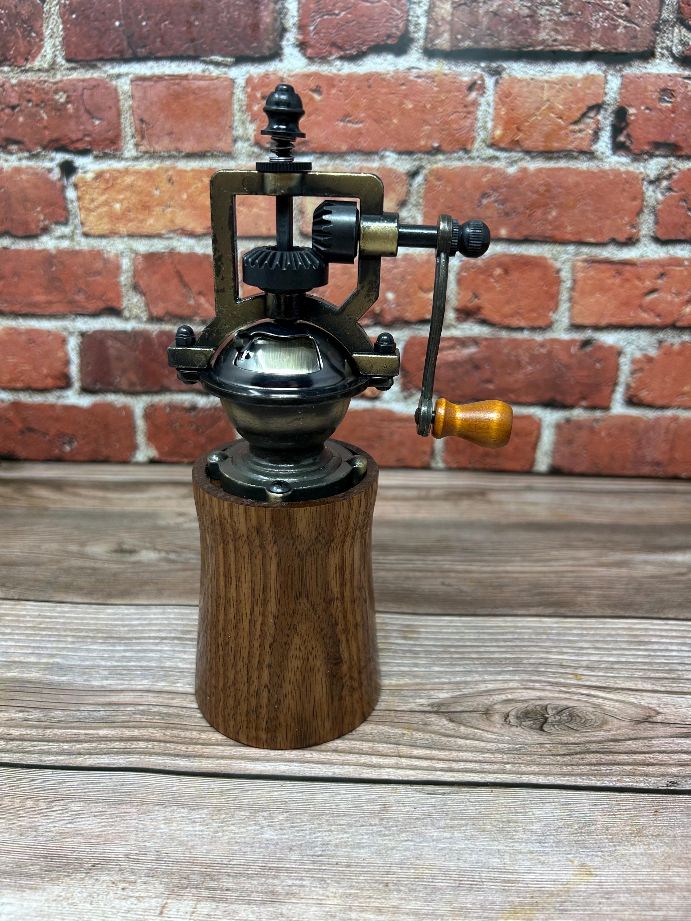 Walnut and brass antique pepper mill