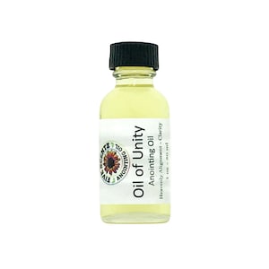 May include: A small, clear glass bottle with a black cap filled with a yellow liquid. The label reads "Oil of Unity Anointing Oil Heavenly Alignment - Clarity 1 oz - 30 ml".