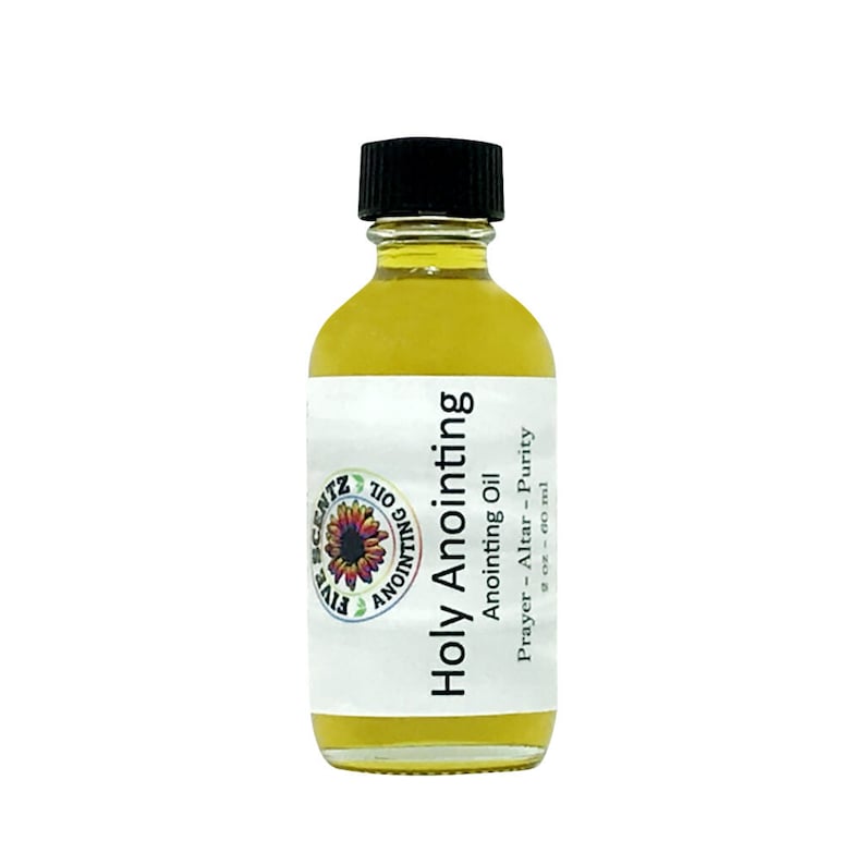 May include: A clear glass bottle with a black cap, filled with yellow liquid. The label reads "Holy Anointing" and "Anointing Oil." The bottle contains 2 fl oz or 60 ml of oil, suitable for prayer, altar, and purity rituals.