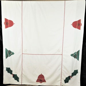May include: White tablecloth with red and green embroidered Christmas designs. The designs include bells, holly, and Christmas trees.
