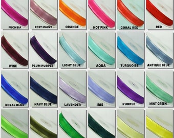 May include: A chart of 24 different colors of ribbon, each color is displayed on a spool. The colors include silver, antique white, white, black, toffee, light pink, fuchsia, rosy mauve, orange, hot pink, coral red, red, wine, plum purple, light blue, aqua, turquoise, antique blue, royal blue, navy blue, lavender, iris, purple, mint green, apple green, moss green, emerald green, hunter green, light yellow, canary yellow, yellow gold, antique gold, light peach, ivory, and dark brown.