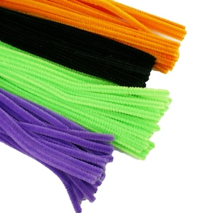May include: A bundle of colorful pipe cleaners in purple, green, black, and orange. The pipe cleaners are bundled together and are ready for crafting.