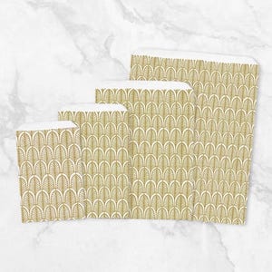 May include: A set of four rectangular paper bags of varying heights, each featuring a repeating gold-colored fan-shaped pattern on a white background. The bags are arranged in a cascading row from the smallest on the left to the largest.