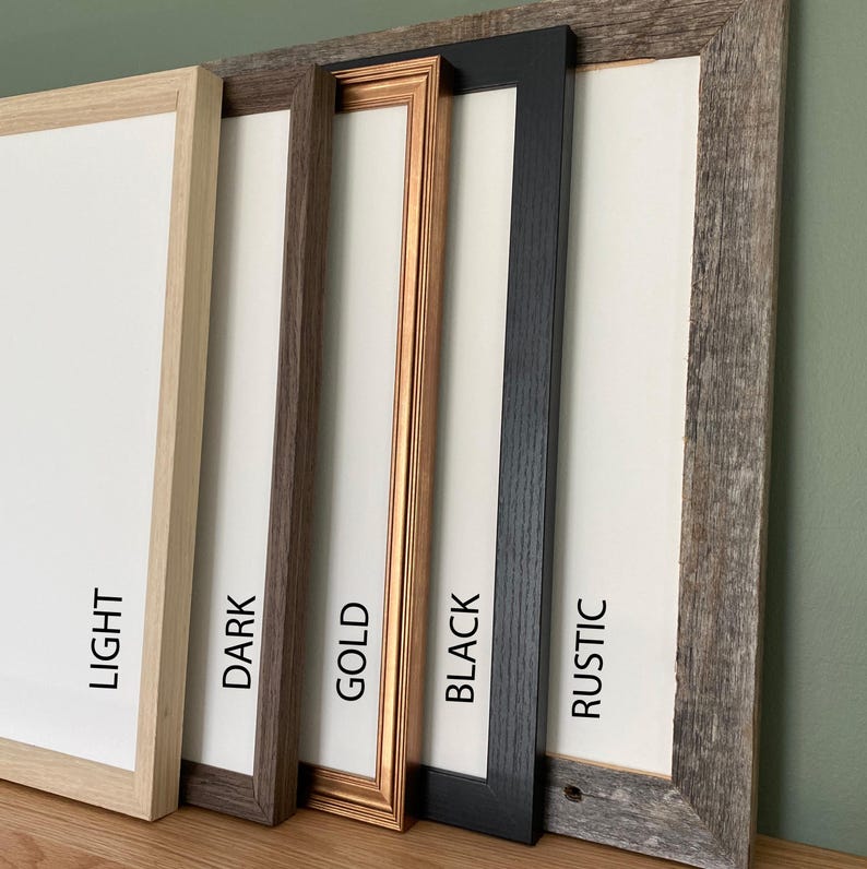 May include: A selection of picture frames in various styles and colors. The frames include light wood, dark brown, gold, black, and rustic wood finishes. Each frame has a white interior, with the frame colors labeled in white text.