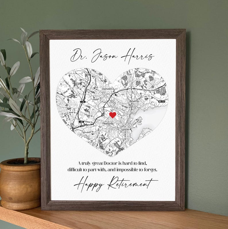May include: A framed print featuring a heart-shaped map with a red heart marker. The print includes the name "Dr. Jason Harris" and the words "Happy Retirement". The map shows the area around Peabody, Massachusetts.