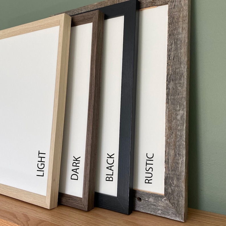 May include: Four picture frames with white matting are displayed. The frames are in different styles and colors: light wood, dark brown, black, and rustic gray. Each frame has a label with its color name: "LIGHT", "DARK", "BLACK", and "RUSTIC".