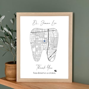 May include: A framed print featuring a map design in the shape of a tooth. The print includes the text "Dr. Jenna Lee", "Thank You", and "You deserve a crown."
