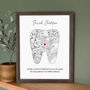 May include: Framed print featuring a tooth-shaped map with a red heart marking a location. The print includes the name "Sarah Jackson" and a thank you message for 13 years of service.