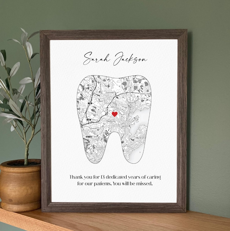 May include: Framed print featuring a tooth-shaped map with a red heart marking a location. The print includes the name "Sarah Jackson" and a thank you message for 13 years of service.