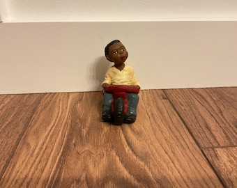 Boy riding a tricycle