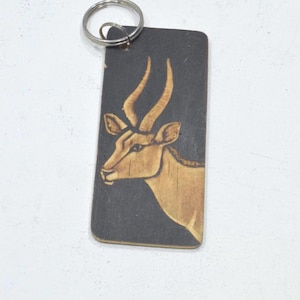 Porte-clés africain en bois sculpté
