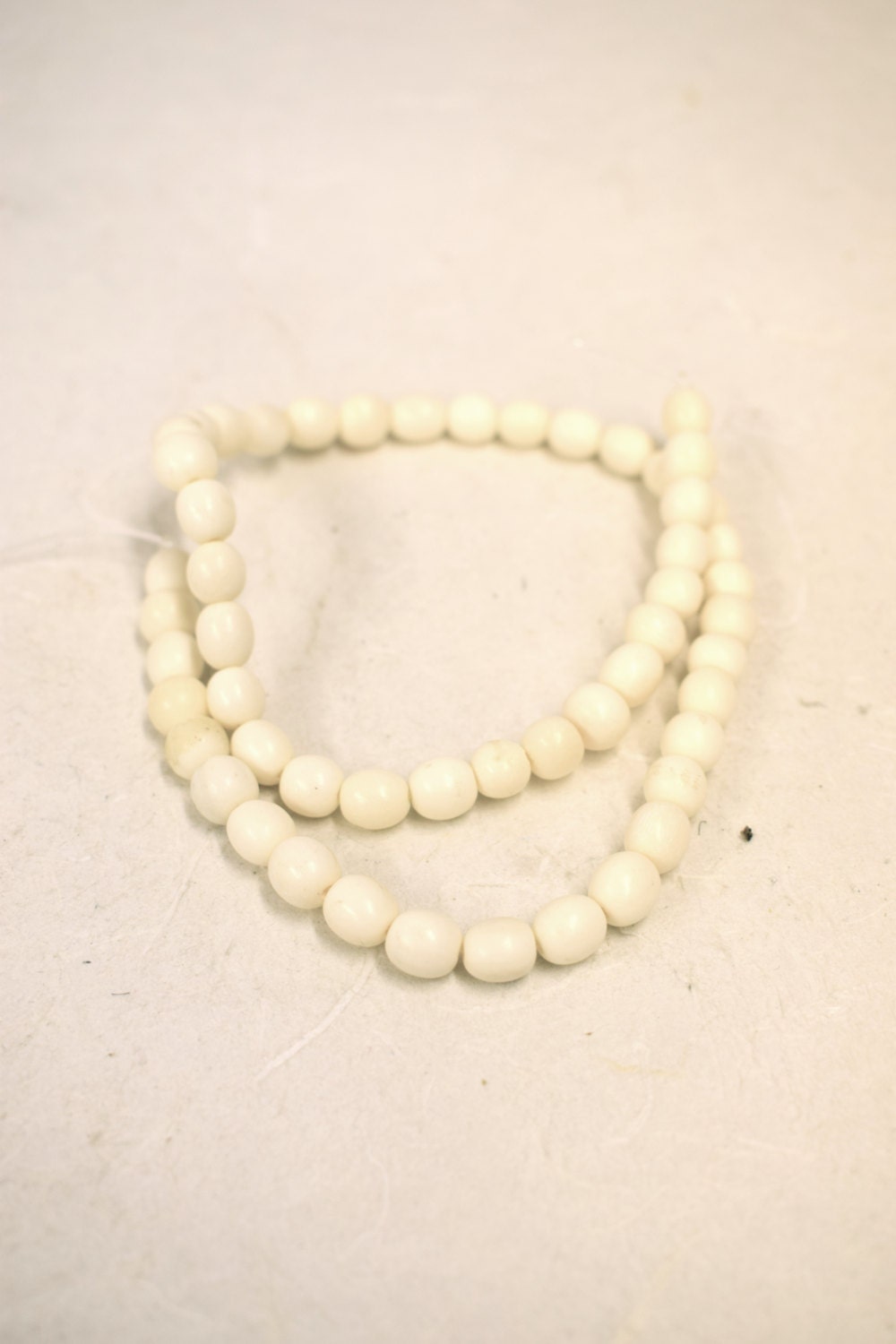 Beads 1 Strand of 53 Vintage Small Oval White Bone Beads Indonesia