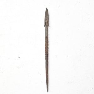 May include: A rusty metal arrowhead with a twisted shaft.