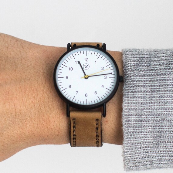 white face leather strap watch