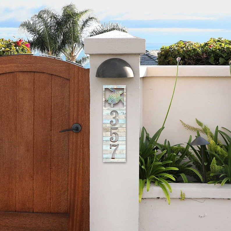 This Sea Turtle House Number Plaque is a stunning and functional piece, perfect for coastal homes, beach houses, and lakefront properties.
