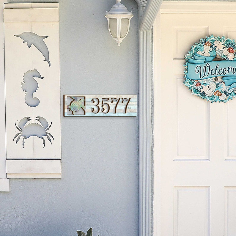 This Sea Turtle House Number Plaque is a stunning and functional piece, perfect for coastal homes, beach houses, and lakefront properties.