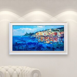 Portovenere oil painting on canvas with rich impasto texture hanging in a modern living room with a white sofa, showing full room decor.