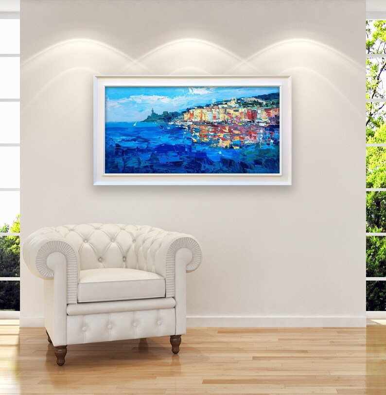 Portovenere oil painting on canvas with rich impasto texture hanging in a modern living room with a white sofa, showing full room decor.