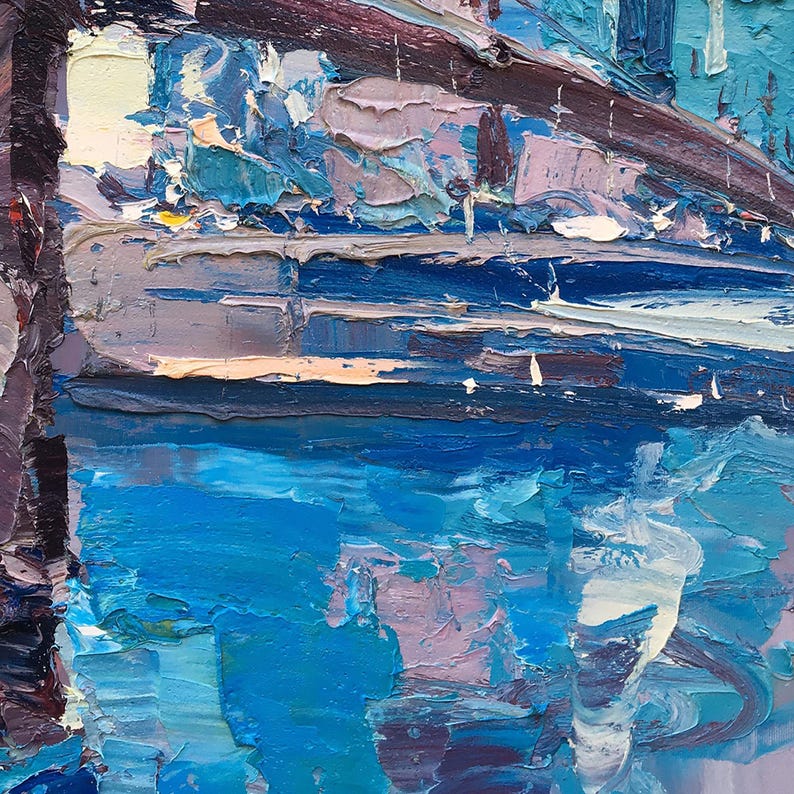 A detail of the Brooklyn Bridge oil painting with thick brushstrokes in shades of blue, purple, and white. The painting depicts a scene of water with a bridge in the background.