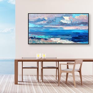 Abstract painting, original oil painting on canvas hanging in a modern living room with table and ocean view and home decor