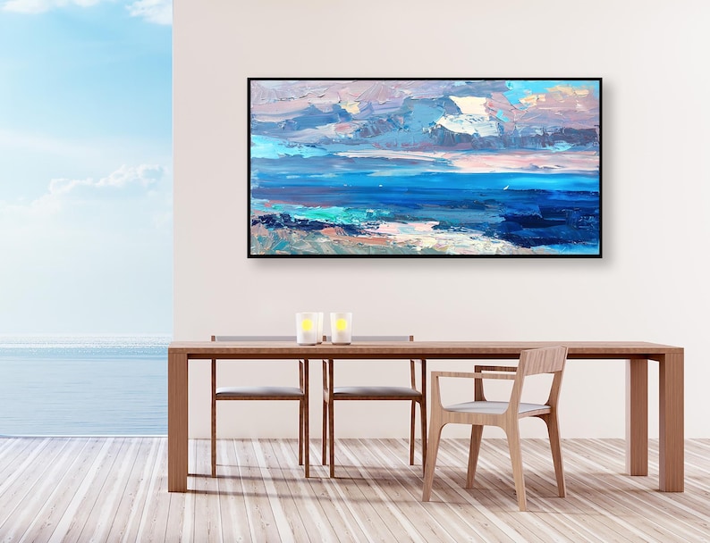 Abstract painting, original oil painting on canvas hanging in a modern living room with table and ocean view and home decor