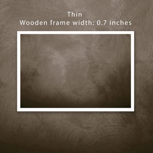 May include: A brown textured background with a white frame around a blank space. The text "Thin Wooden frame width: 0.7 inches" is above the frame.