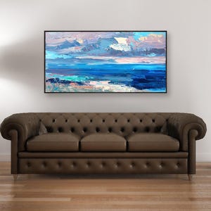Abstract painting, original oil painting on canvas hanging in a modern living room with a brown sofa and home decor