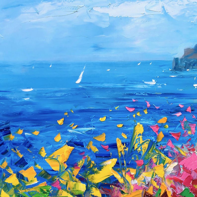 Original hand-painted oil painting on canvas close-up showing expressive palette knife texture, layered blue sea tones, and dynamic brushstrokes capturing the movement of the Mediterranean water with colorful coastal flowers in the foreground.