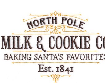 Christmas North Pole Milk and Cookie Co embroidered Holiday apron.