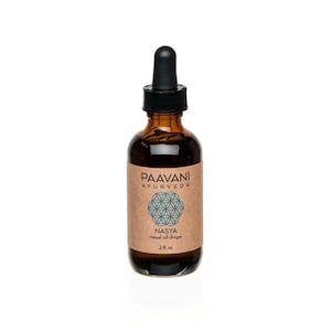 May include: A brown glass bottle with a black dropper top. The label is brown with the text "Paavani Ayurveda" and a geometric design. The text "Nasya nasal oil drops" and "2 fl. oz." are also on the label.