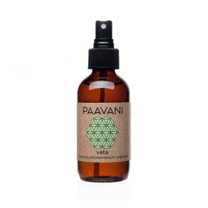 May include: A brown glass bottle with a black spray nozzle and a brown paper label. The label has a green and white mandala design and the text "PAAVANI Vata CALMING AROMATHERAPY SPRITZER".