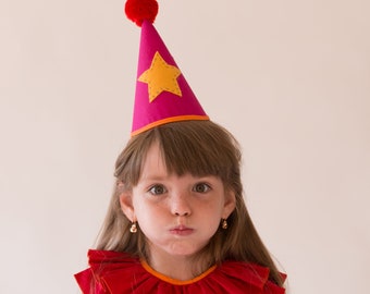 pink clown hat with red collar