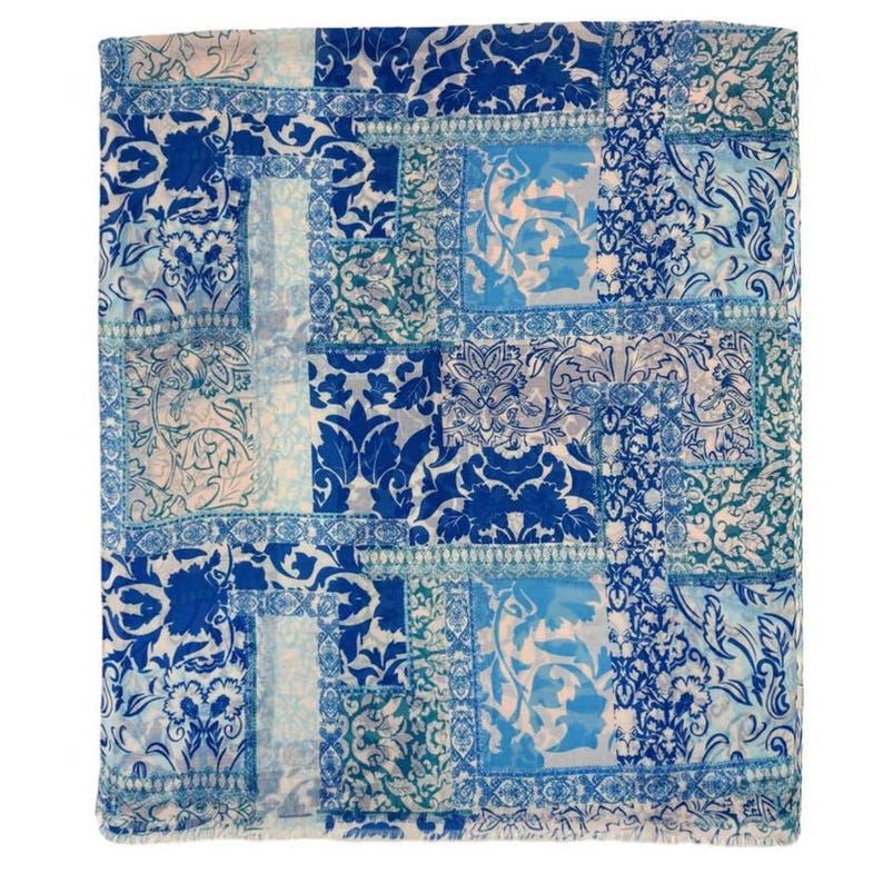 May include: A square, patterned textile in shades of blue and white. The design features a patchwork of floral and damask patterns in varying shades of blue, creating a visually rich and textured appearance. The overall aesthetic is elegant and decorative.