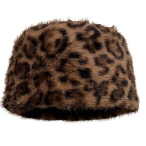 May include: A bucket hat made of soft, faux fur material featuring a brown and black leopard print pattern. The hat has a rounded crown and a short, downward-sloping brim, showcasing a dense, textured surface throughout the entire exterior.
