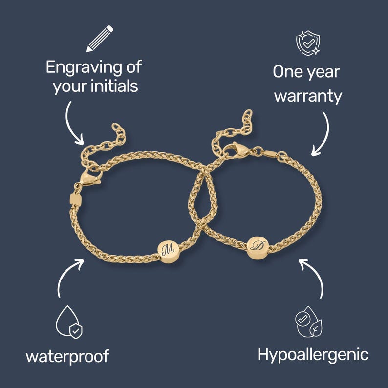 May include: Two gold-colored bracelets with a woven chain design. Each bracelet features a round charm with an engraved initial. The image includes text that says "Engraving of your initials", "One year warranty", "waterproof", and "Hypoallergenic".