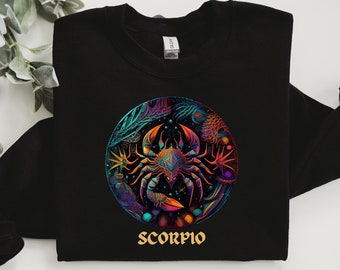 May include: Black sweatshirt featuring a colourful graphic of a scorpion within a circle, with the word "Scorpio" beneath it.