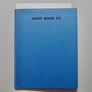May include: A blue book with the text "ARMY BOOK 577" printed on the front cover.
