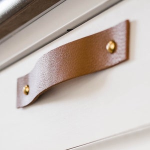 Leather Handles installed on a white dresser.