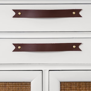 Leather Handles installed on a white dresser.